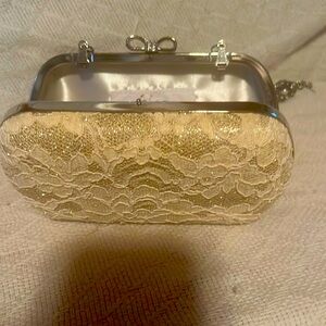Beautiful creamed colored, clutch, with chain .